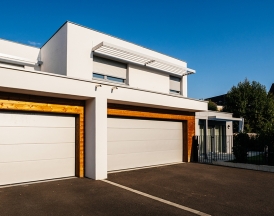house architecture style with large garage automated door